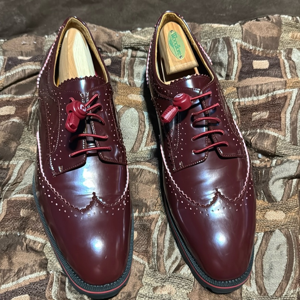 Christian Louboutin. I changed those shoestrings. Wore them a few times as well.
